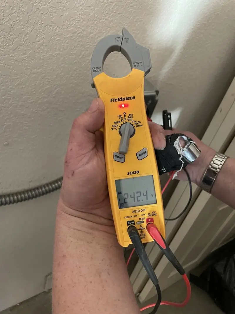 Voltage testing with clamp meter during Aluminum Wiring Replacement in Erwin